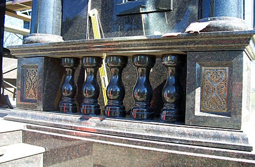 Bronze inlays in the corner posts of mausoleum.